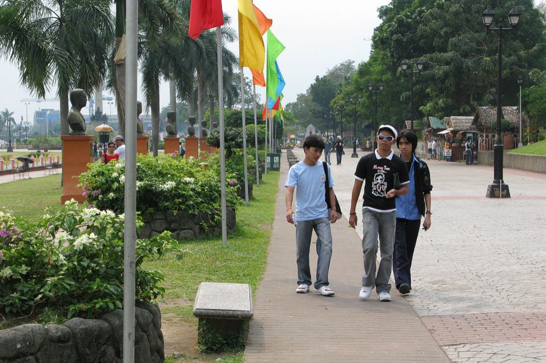 People walking through Rizal Park in central Manila